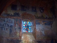 Saint-Michel d'Aiguilhe interior with murals and stained glass window